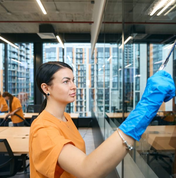 Qualified employees of the cleaning company clean and disinfect all surfaces in the coworking space