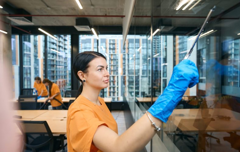 Qualified employees of the cleaning company clean and disinfect all surfaces in the coworking space